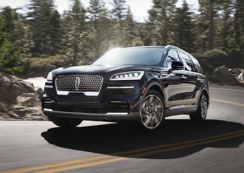 A Lincoln Aviator® SUV is being driven on a winding mountain road | Palmetto Lincoln in Charleston SC
