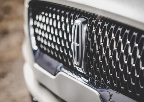 The grille of the 2024 Lincoln Aviator® Reserve model with an eye-catching repeated field of Lincoln Star logo shapes | Palmetto Lincoln in Charleston SC